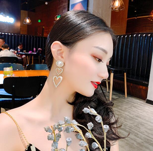 Double Heart Pearl Earrings – Luxury That Speaks Love